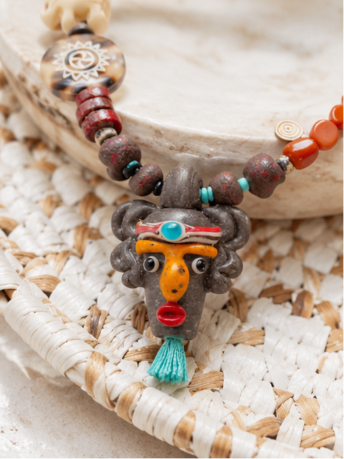 Tribal Rhythm Goddess Necklace – African Bead Statement Necklace with Double-Sided Clay Face Pendant