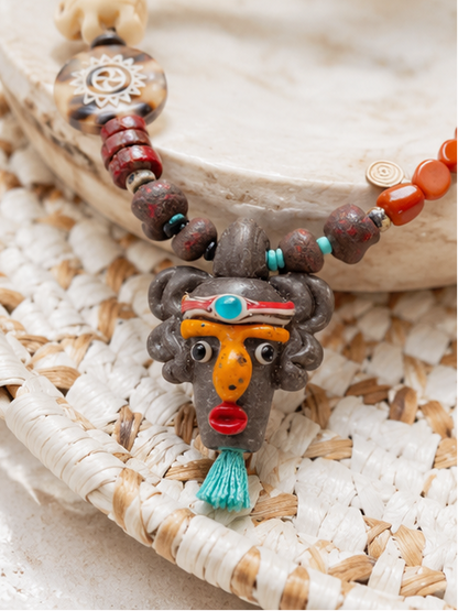 Tribal Rhythm Goddess Necklace – African Bead Statement Necklace with Double-Sided Clay Face Pendant
