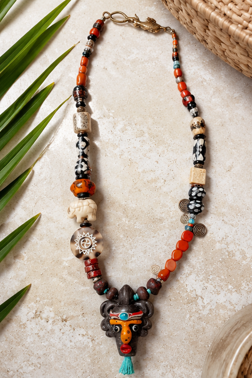 Tribal Rhythm Goddess Necklace – African Bead Statement Necklace with Double-Sided Clay Face Pendant