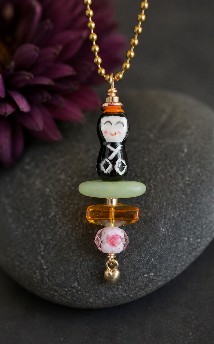 Little Peace Doll Necklace – Ceramic Asian Figurine with Glass & Heart Charm (30” Chain)
