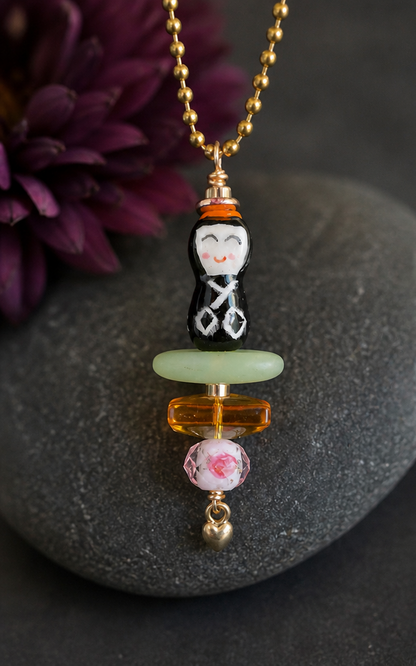 Little Peace Doll Necklace – Ceramic Asian Figurine with Glass & Heart Charm (30” Chain)