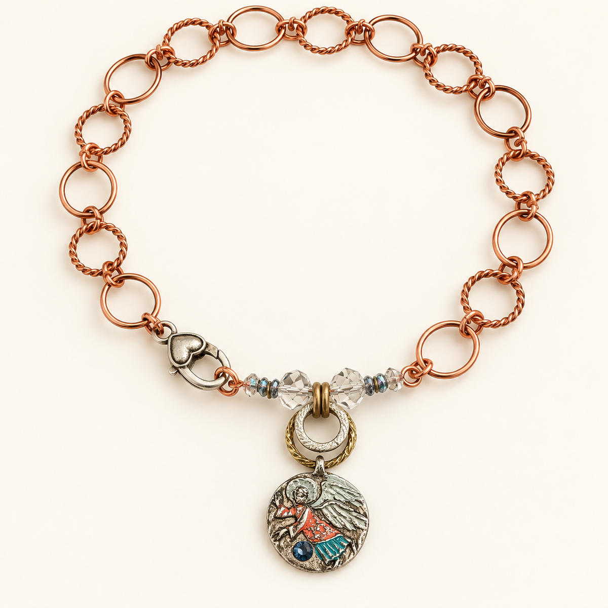 16-inch copper guardian angel necklace with a coral and turquoise handpainted pendant, rhinestone, Swarovski crystals and silver-tone heart lobster clasp.

