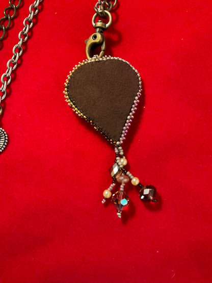 Ocean Relic – Embroidered Nautilus Crystal Talisman Necklace”